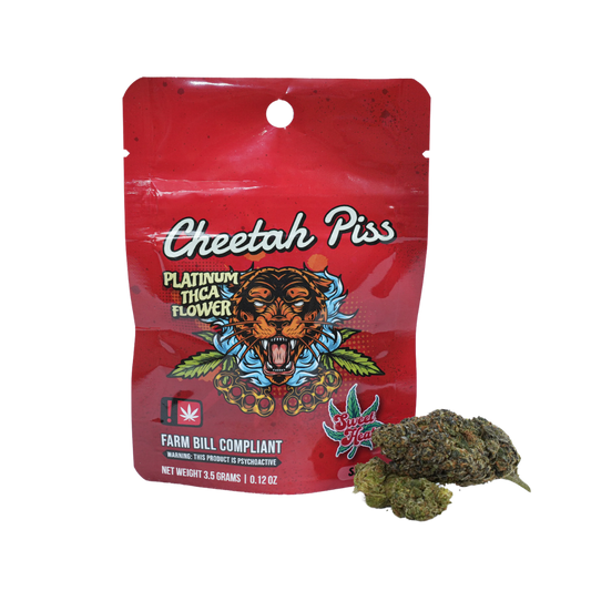 A red packaging labeled "Cheetah Piss" featuring a fierce tiger design, with cannabis