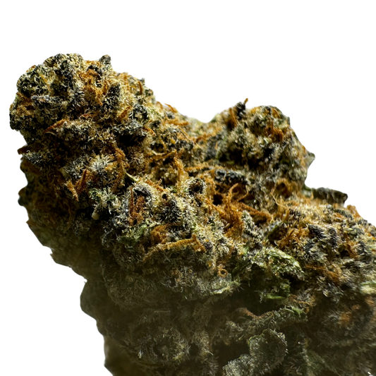 Close-up of a dense cannabis bud with a mix of green and orange hues