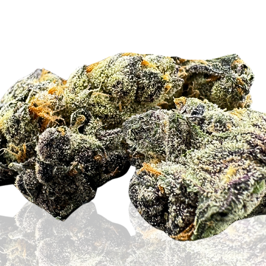 Close-up of vibrant cannabis buds, displaying a mix of green, purple, and orange hues.