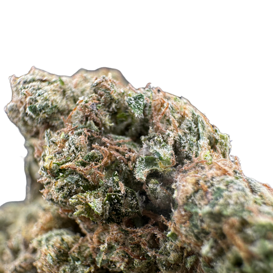 Cannabis bud with dense green foliage and orange hairs, coated in glistening trichomes.