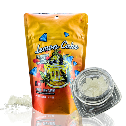 A packaging of "Lemon Cake" THCA diamonds beside a glass jar filled with crystalline substance