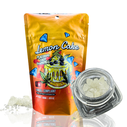 A packaging of "Lemon Cake" THCA diamonds beside a glass jar filled with crystalline substance